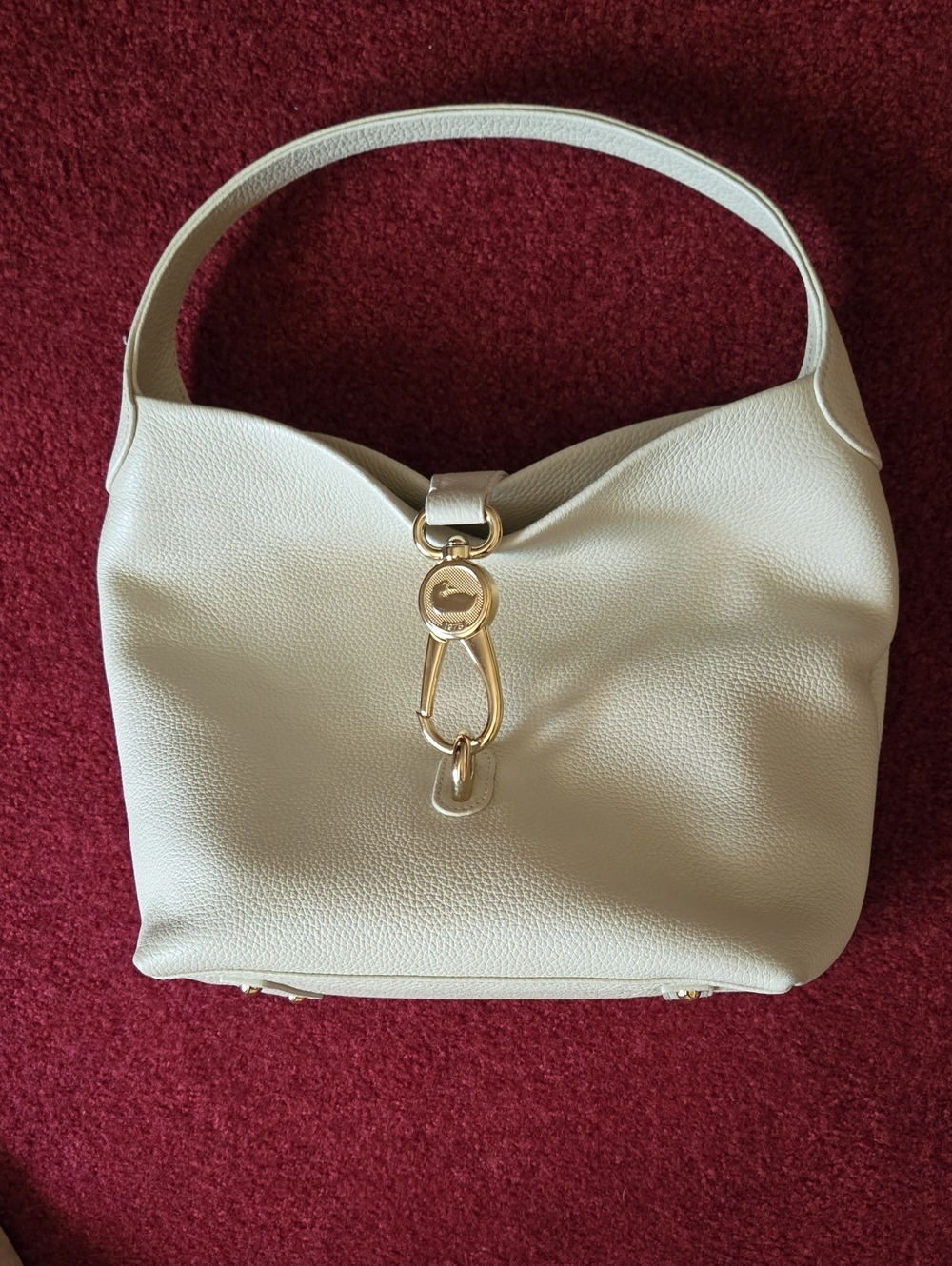 Dooney and Bourke  ivory leather Logo Lock shoulder Bag with Gold Hardware